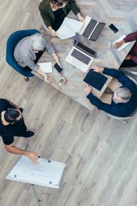 Top,View,Of,A,Male,Office,Worker,Giving,Presentation,To
